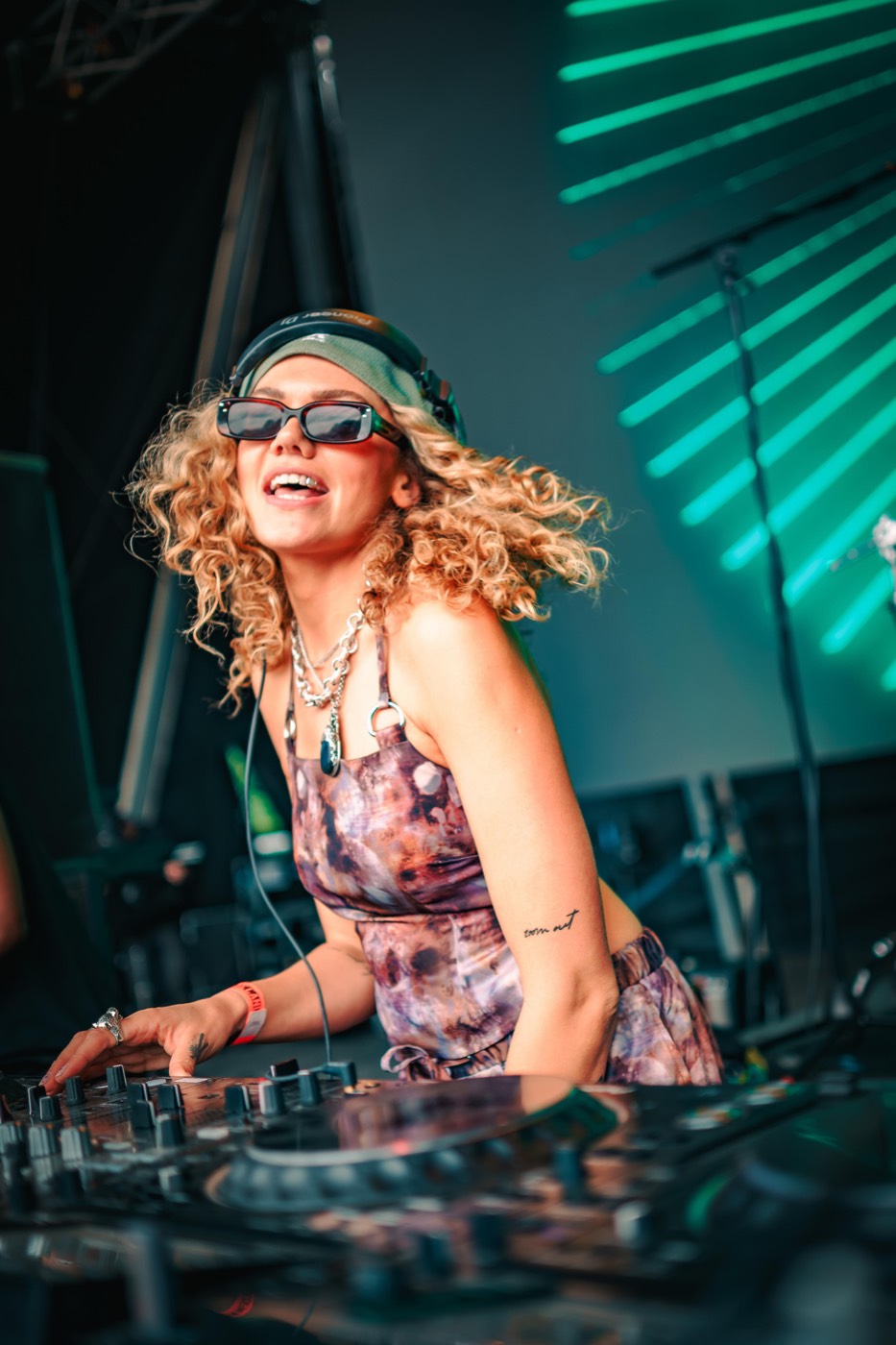 Becca D smiling behind the decks